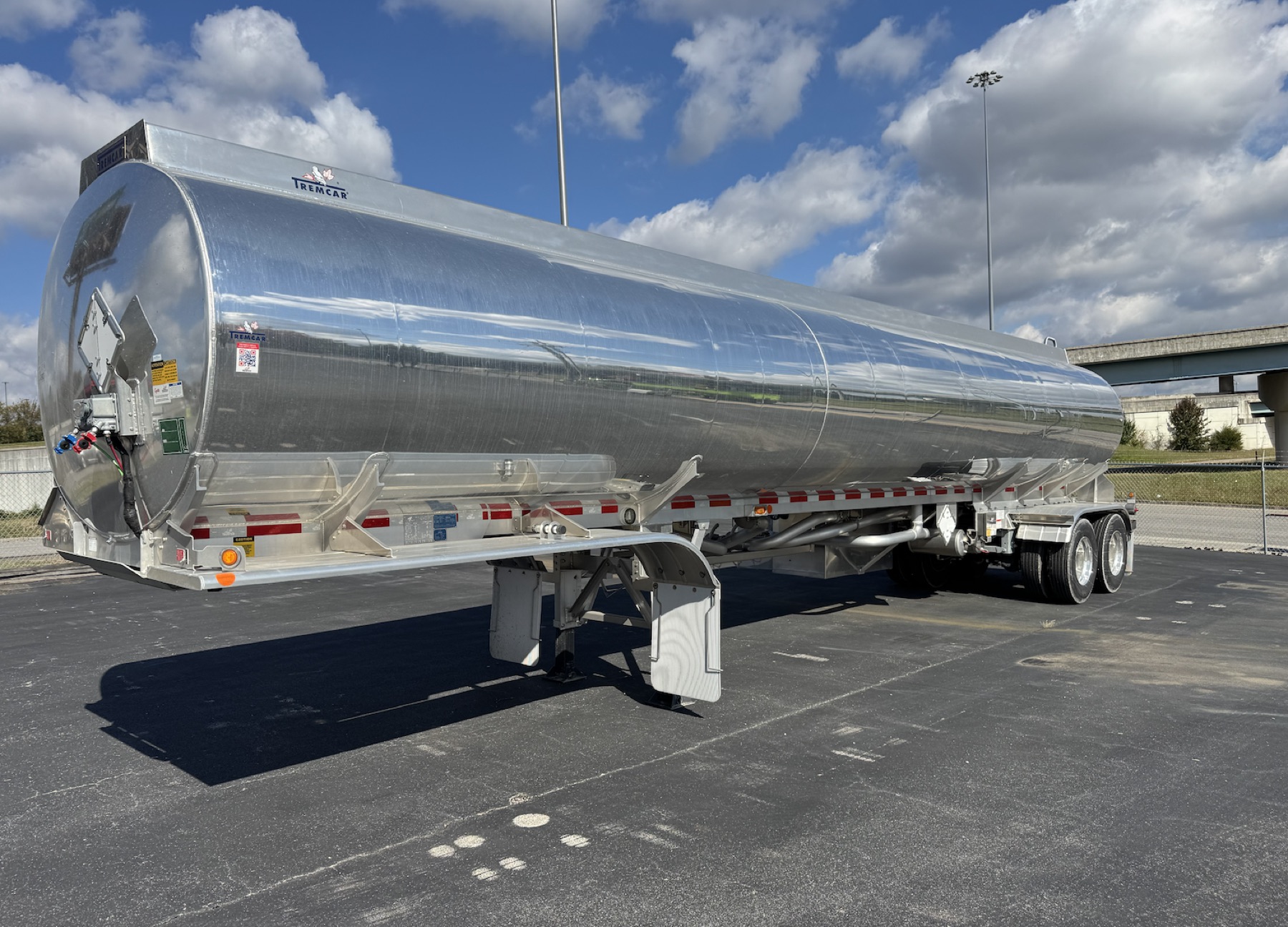 A polished aluminum Tremcar tank trailer on the Post Leasing lot in Knoxville